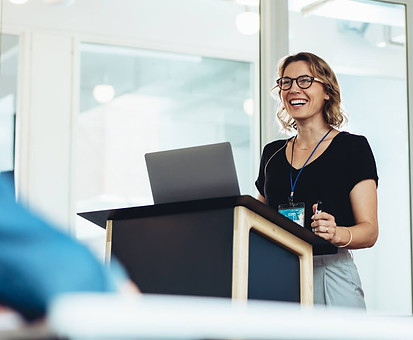 A woman speaking at a lectern