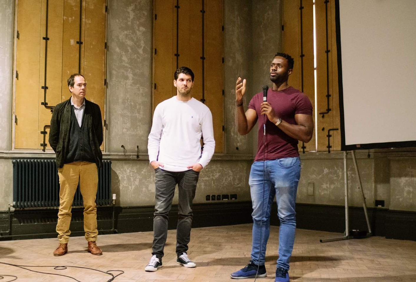 Stop Holding Back speakers presenting on stage